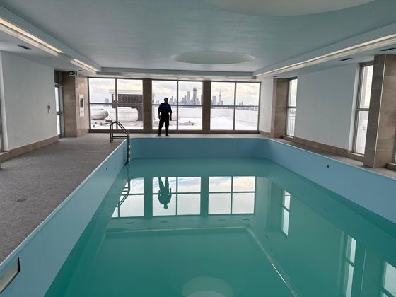 Indoor rooftop pool, CN Tower view, Toronto